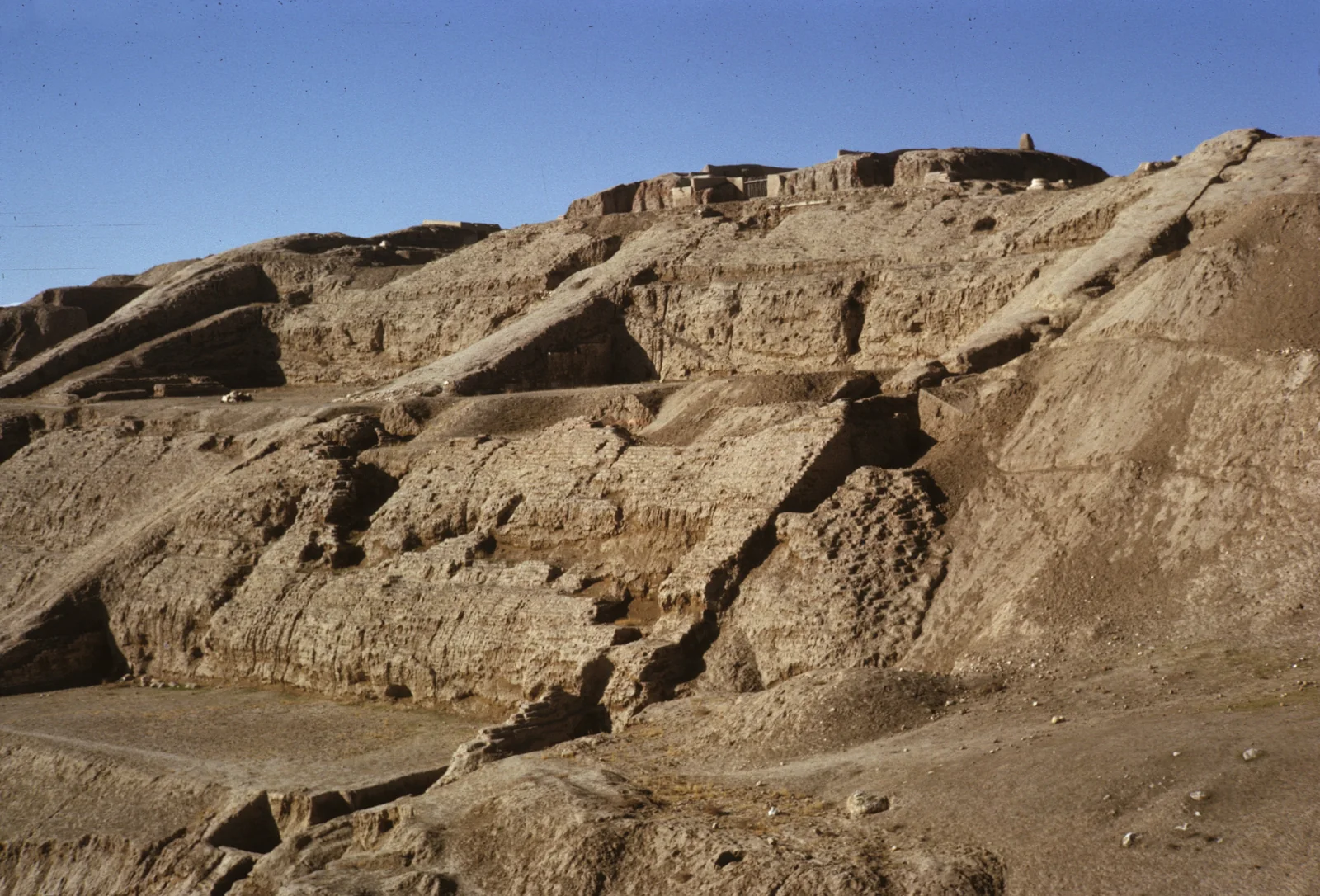 Stone stairways climbing the terraced hillside at Surkh Kotal in a 1963 photograph.